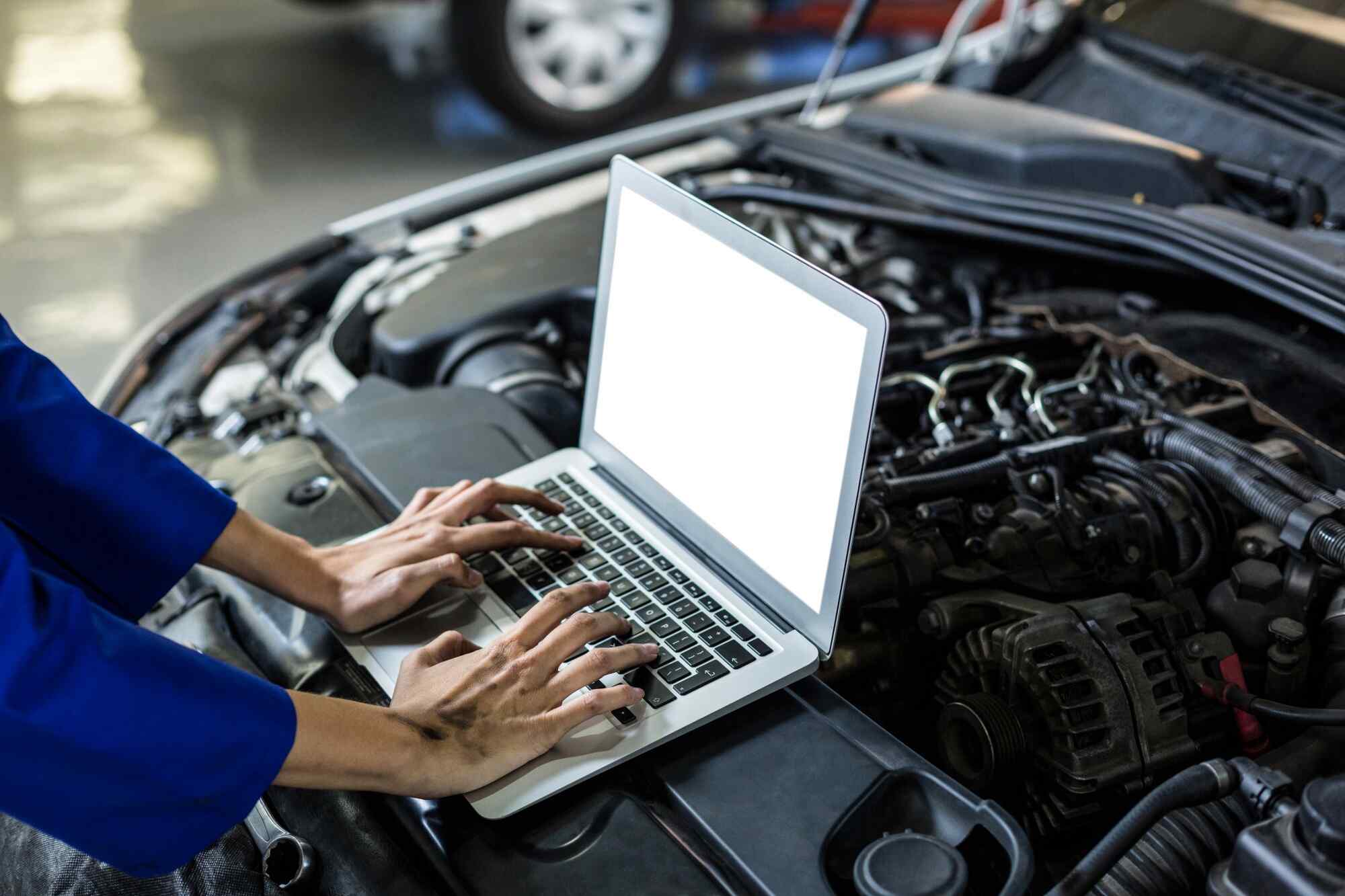 hands-female-mechanic-using-laptop (1)